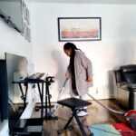 child hoovering the house
